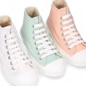 Cotton canvas High Sneaker shoes with shoelaces and with toe cap in pastel colors.