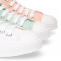 Cotton canvas High Sneaker shoes with shoelaces and with toe cap in pastel colors.