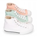 Cotton canvas High Sneaker shoes with shoelaces and with toe cap in pastel colors.