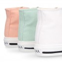 Cotton canvas High Sneaker shoes with shoelaces and with toe cap in pastel colors.