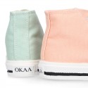 Cotton canvas High Sneaker shoes with shoelaces and with toe cap in pastel colors.