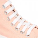 Cotton canvas High Sneaker shoes with shoelaces and with toe cap in pastel colors.