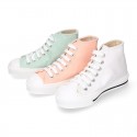 Cotton canvas High Sneaker shoes with shoelaces and with toe cap in pastel colors.