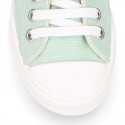 Cotton canvas High Sneaker shoes with shoelaces and with toe cap in pastel colors.