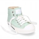 Cotton canvas High Sneaker shoes with shoelaces and with toe cap in pastel colors.