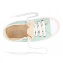 Cotton canvas High Sneaker shoes with shoelaces and with toe cap in pastel colors.