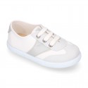 Combined cotton canvas kids tennis shoes with laces closure.