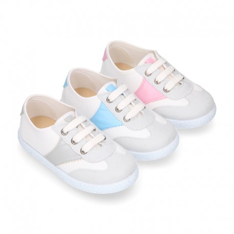 Combined cotton canvas kids tennis shoes with laces closure.