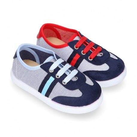 Combined Cotton canvas tennis shoes with ties closure.