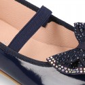 Girl´s PATENT finish ballet flats with STRASS BOW and elastic band.