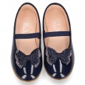 Girl´s PATENT finish ballet flats with STRASS BOW and elastic band.