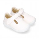 Cotton canvas kids T-Bar sandal shoes with hook and loop strap closure.