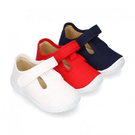 Cotton canvas kids T-Bar sandal shoes with hook and loop strap closure.