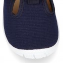 Cotton canvas kids T-Bar sandal shoes with hook and loop strap closure.
