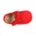 Cotton canvas kids T-Bar sandal shoes with hook and loop strap closure.