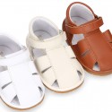 Nappa soft leather sandals for baby boys with hook and loop closure.