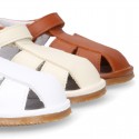 Nappa soft leather sandals for baby boys with hook and loop closure.