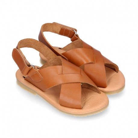 TAN color leather Kids sandal shoes with crossed straps design.