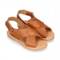 TAN color leather Kids sandal shoes with crossed straps design.
