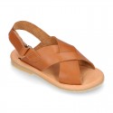 TAN color leather Kids sandal shoes with crossed straps design.