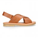 TAN color leather Kids sandal shoes with crossed straps design.