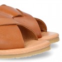 TAN color leather Kids sandal shoes with crossed straps design.