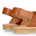 TAN color leather Kids sandal shoes with crossed straps design.