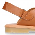 TAN color leather Kids sandal shoes with crossed straps design.