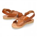 TAN color leather Kids sandal shoes with crossed straps design.