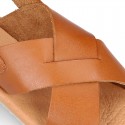 TAN color leather Kids sandal shoes with crossed straps design.