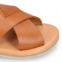 TAN color leather Kids sandal shoes with crossed straps design.