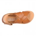 TAN color leather Kids sandal shoes with crossed straps design.