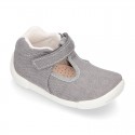 Cotton canvas Kids T-Strap shoes with hook and loop closure, counter and toe cap.