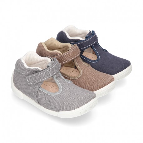 Cotton canvas Kids T-Strap shoes with hook and loop closure, counter and toe cap.