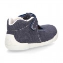 Cotton canvas Kids T-Strap shoes with hook and loop closure, counter and toe cap.