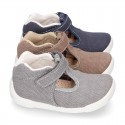 Cotton canvas Kids T-Strap shoes with hook and loop closure, counter and toe cap.