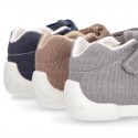 Cotton canvas Kids T-Strap shoes with hook and loop closure, counter and toe cap.