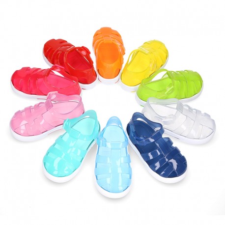 Tennis style kids jelly shoes with button and clip closure for Beach and Pool.