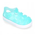 Tennis style kids jelly shoes with button and clip closure for Beach and Pool.