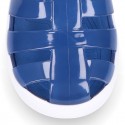 Tennis style kids jelly shoes with button and clip closure for Beach and Pool.