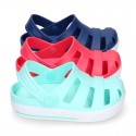 Kids jelly shoes with OLA CLOG design for beach and pool use.