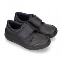 Kids OKAA School shoes closed with laceless and reinforced toe cap in washable leather.