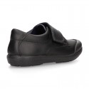 Kids OKAA School shoes closed with laceless and reinforced toe cap in washable leather.