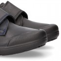 Kids OKAA School shoes closed with laceless and reinforced toe cap in washable leather.