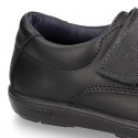 Kids OKAA School shoes closed with laceless and reinforced toe cap in washable leather.