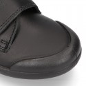 Kids OKAA School shoes closed with laceless and reinforced toe cap in washable leather.