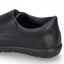 Kids OKAA School shoes closed with laceless and reinforced toe cap in washable leather.