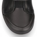 Kids OKAA School shoes closed with laceless, elastic band and reinforced toe cap in washable leather.