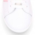 Washable leather OKAA kids School tennis shoes with laces, stripes design and toe cap.