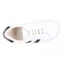 Washable leather OKAA kids School tennis shoes with laces, stripes design and toe cap.